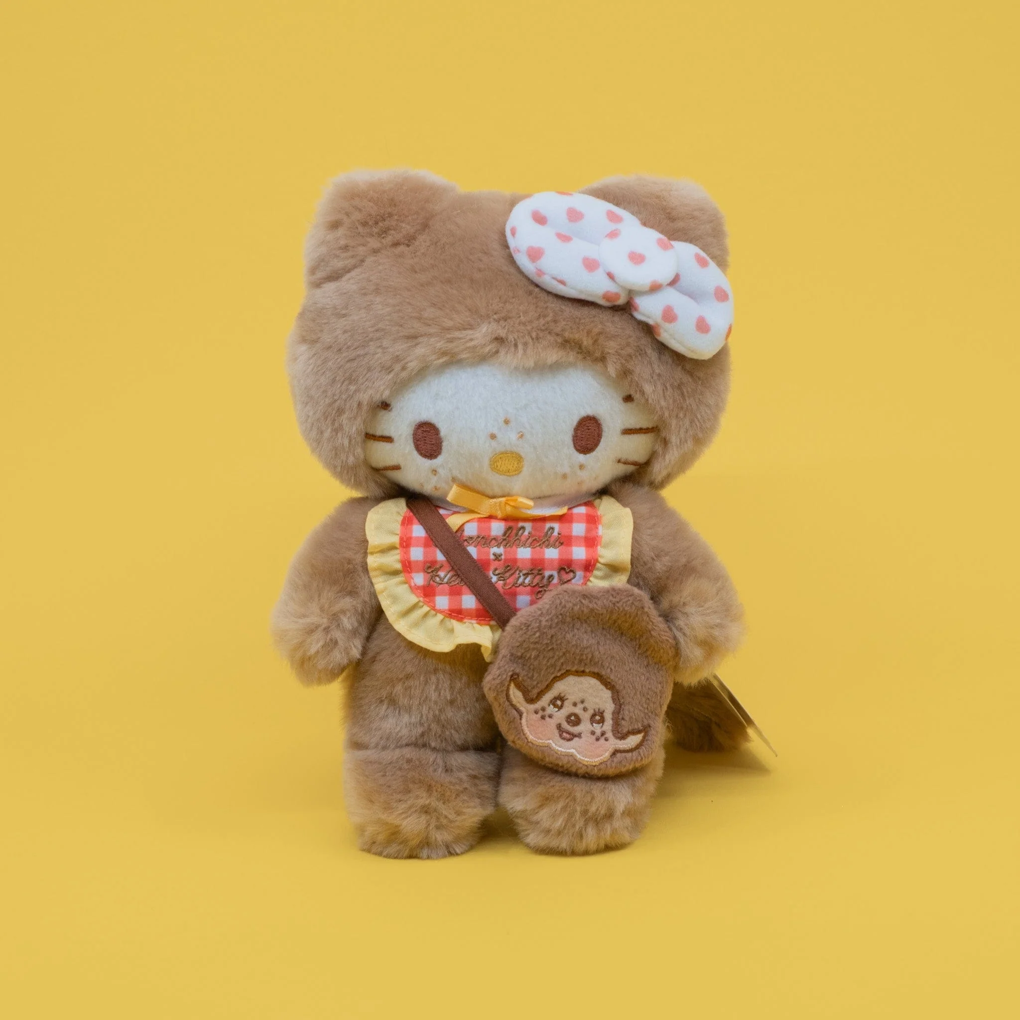 Peluche de Hello Kitty x Monchhichi (Hello Kitty con babero de cuadros)